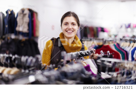 Smiling girl at clothing store 12716321