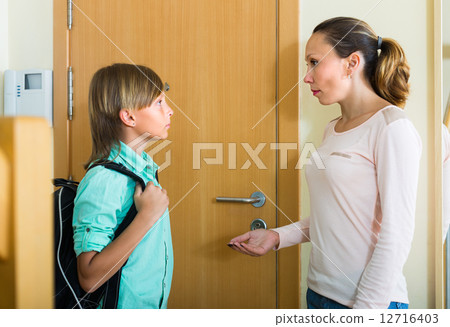 Mother and son near door 12716403