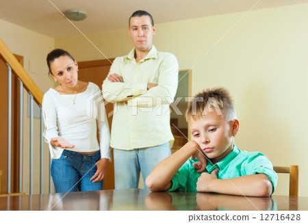 Parents berates her teenage child in interior 12716428