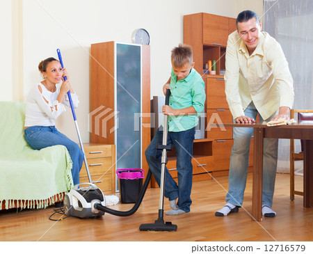 Ordinary family doing house cleaning Ordinary family doing house cleaning 12716579