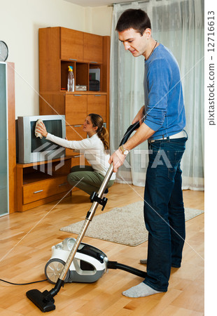 Happy family doing housework together 12716613