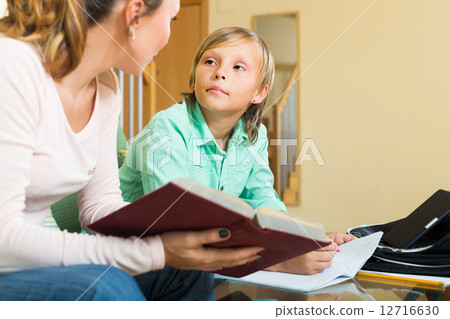 Mother with son doing homework Mother with son doing homework 12716630