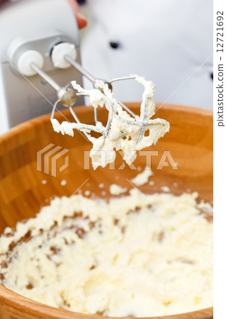 electric mixer with a dough with beaten 12721692