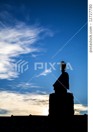 Buddha on a roof Buddha on a roof 12727780