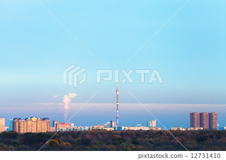 sunset blue sky over urban houses and TV tower sunset blue sky over urban houses and TV tower 12731410
