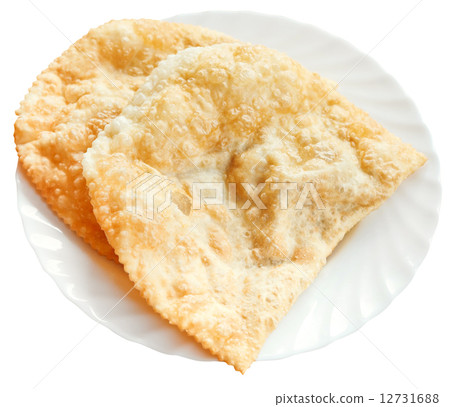 cheburek pie on white plate isolated cheburek pie on white plate isolated 12731688