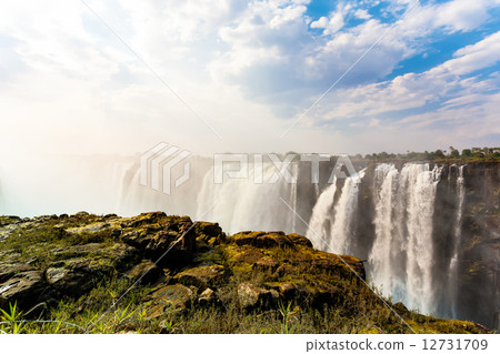The Victoria falls with dramatic sky 12731709