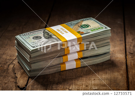 Stacks of new 100 US dollars 2013 banknotes 12733571