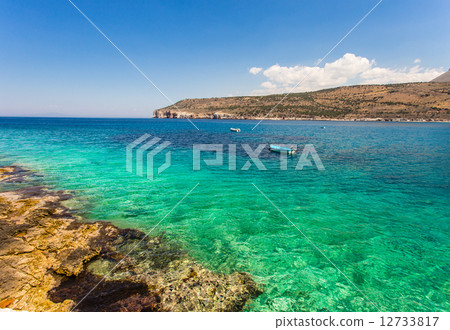 seascape with small fisherman boat 12733817
