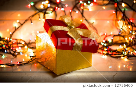 open gift box with light coming out of it open gift box with light coming out of it 12736400