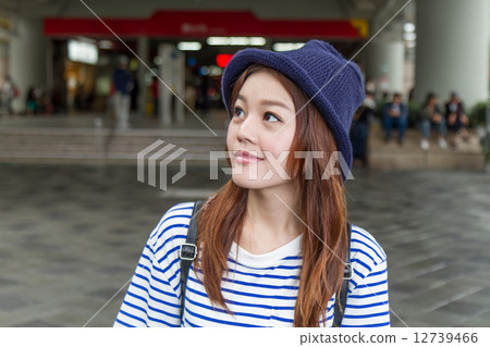 Asian woman outside subway station 12739466