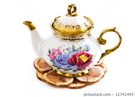 Ceramic teapot on Wooden stand . Ceramic teapot on Wooden stand . 12741495