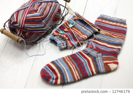 Hand-knitted socks in production 12746179