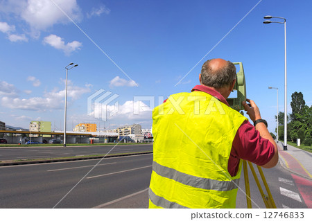 Surveyor measuring 12746833