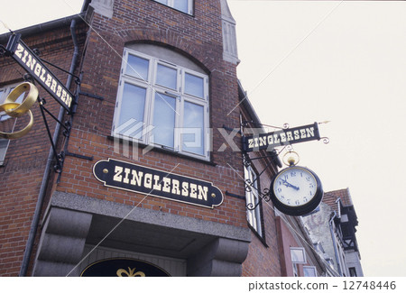 Signs of a clock shop at the street corner of Odense 12748446