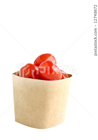 Tomatos in paper bag on white background 12748672