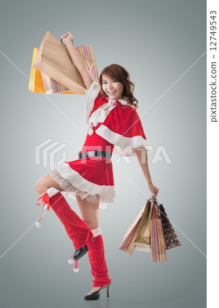 Asian Christmas girl hold shopping bags Asian Christmas girl hold shopping bags 12749543