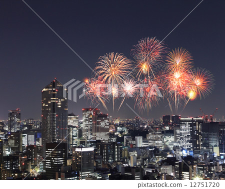 Fireworks celebrating over Tokyo cityscape at night Fireworks celebrating over Tokyo cityscape at night 12751720