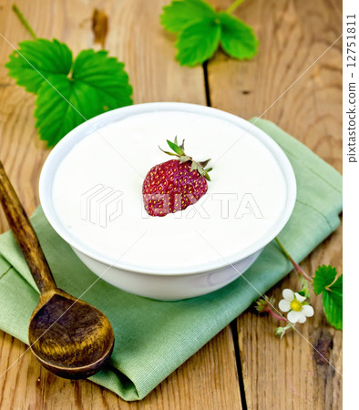 Yogurt thick with strawberries in bowl on board 12751811