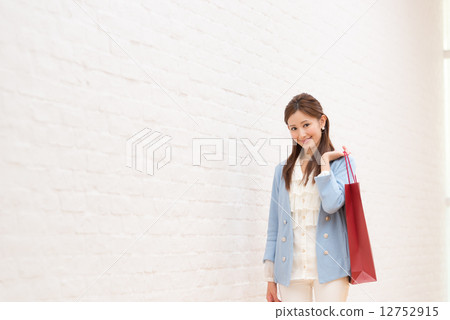 Woman on the way home from shopping 12752915