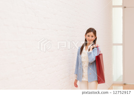 Woman on the way home from shopping 12752917