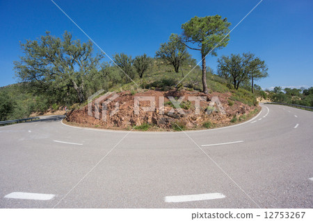 Worms eye view of mountain hairpin bend curved road 12753267