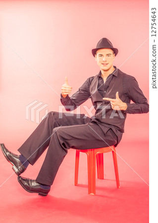 Handsome young man wearing a fashionable hat Handsome young man wearing a fashionable hat 12754643