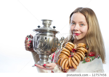 Beautiful blond young woman with tea samovar Beautiful blond young woman with tea samovar 12757456