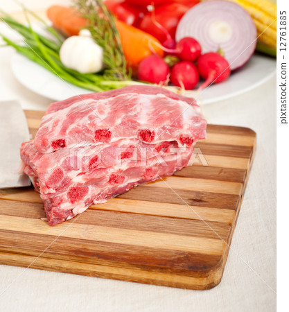 chopping fresh pork ribs and vegetables chopping fresh pork ribs and vegetables 12761885