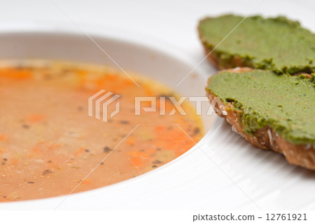 Italian minestrone soup with pesto crostini on side 12761921