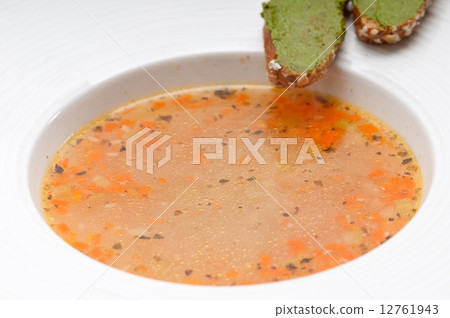 Italian minestrone soup with pesto crostini on side 12761943