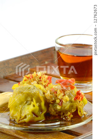 Dim Sum, Chinese Appetizer served with hot and spicy dipping sauce. Dim Sum, Chinese Appetizer served with hot and spicy dipping sauce. 12762673