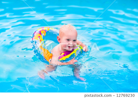 Little boy in swimming pool 12769230