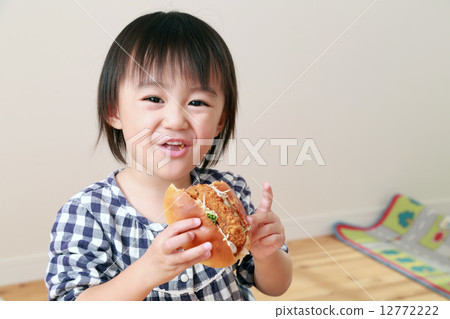 Baby eating bread 12772222
