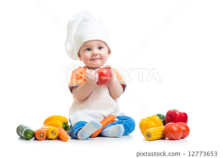 Baby wearing a chef hat with vegetables 12773653