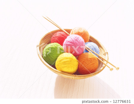 Yarn ball and knitting stick 12776631