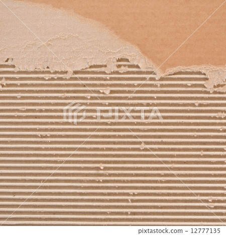 Torn corrugated cardboard. Torn corrugated cardboard. 12777135