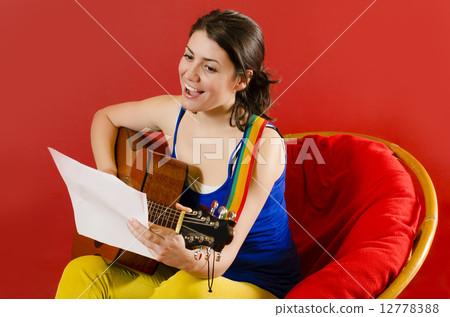 Playing Guitar Playing Guitar 12778388