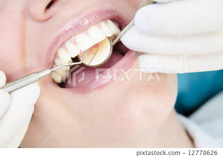 Dentist Examining Dentist Examining 12778626