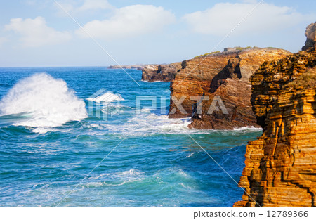 Waves break about rocks, the Atlantic Ocean at the coast of Portugal 12789366