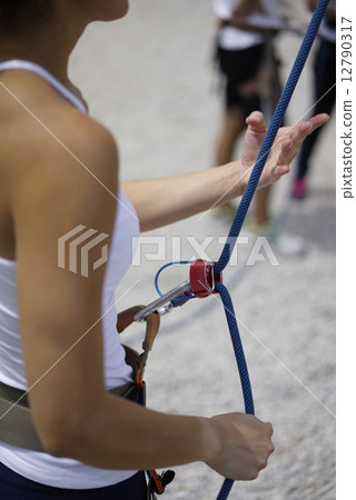 Close up of Woman's hand in belaying activities Close up of Woman's hand in belaying activities 12790317