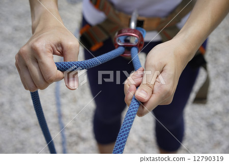 Close up of Woman's hand in belaying activities Close up of Woman's hand in belaying activities 12790319