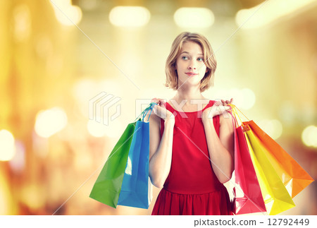 A woman with a colorful bag 12792449