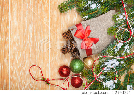Christmas wooden background with snow fir tree and decor Christmas wooden background with snow fir tree and decor 12793795