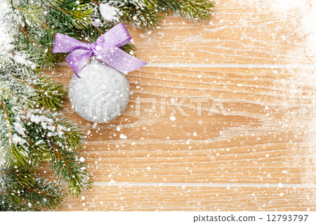 Christmas wooden background with snow fir tree and decor Christmas wooden background with snow fir tree and decor 12793797