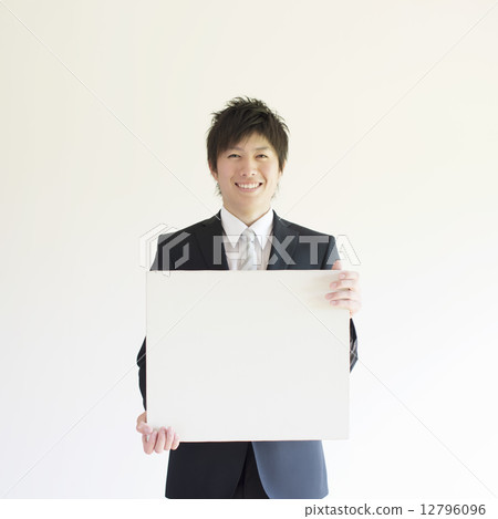 A businessman with a message board 12796096