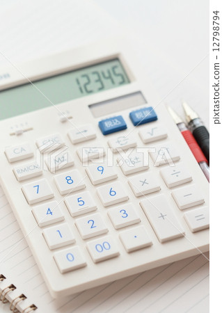 Notes and ballpoint pen and calculator 12798794