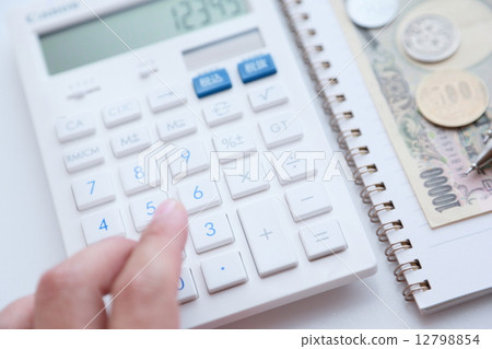Hand hitting a calculator Hand hitting a calculator 12798854
