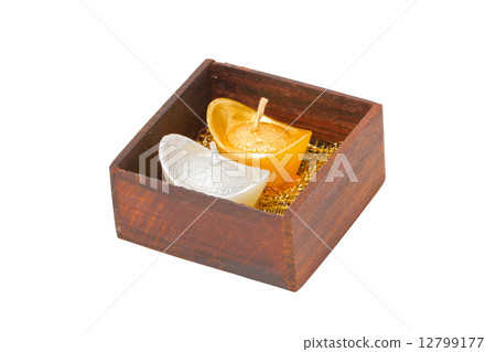 Artificial wedding souvenir candles in wooden box isolated on wh Artificial wedding souvenir candles in wooden box isolated on wh 12799177