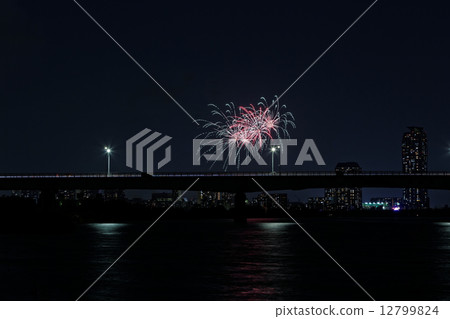 Fireworks and landscape reflected on the river 12799824